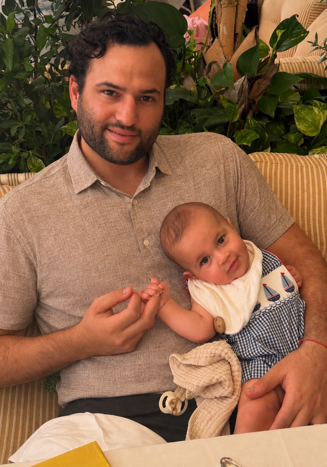 Steve Michaelsen holding his infant son